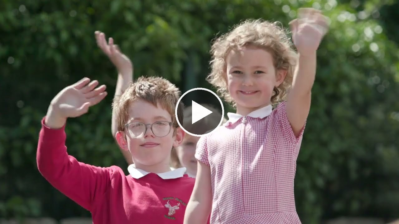 Children waving: play our school film, four minutes of a day at South Darley C.E. Primary School (opens YouTube)
